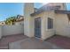 Private patio with door to interior and stucco walls at 1222 W Baseline Rd # 121, Tempe, AZ 85283