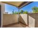 Private patio area with brick flooring and stucco walls at 1222 W Baseline Rd # 121, Tempe, AZ 85283