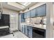 Kitchen features light countertops, blue cabinets, and a view into the dining area at 1222 W Baseline Rd # 121, Tempe, AZ 85283