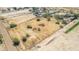 Aerial view of property showing a large lot with surrounding desert landscape and small structures at 11841 N Lavern Ln, Maricopa, AZ 85139