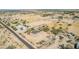 Aerial view of a house on a large lot with surrounding desert landscape at 11841 N Lavern Ln, Maricopa, AZ 85139