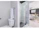 Bathroom with toilet, shower, and view of bedroom at 8301 E Crestwood Way, Scottsdale, AZ 85250