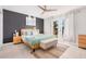 Bright bedroom with a queen bed and access to a patio at 8301 E Crestwood Way, Scottsdale, AZ 85250