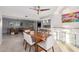 Open dining area with a wood table and modern bar stools at 8301 E Crestwood Way, Scottsdale, AZ 85250