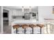 Modern kitchen with white cabinets and stainless steel appliances at 8301 E Crestwood Way, Scottsdale, AZ 85250