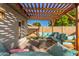 Outdoor patio area with pergola and seating at 8301 E Crestwood Way, Scottsdale, AZ 85250
