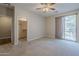 Bedroom with sliding door to balcony and mirrored closet at 1406 W Main St # 120, Mesa, AZ 85201