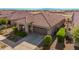 Single story home with tile roof and two-car garage at 20403 W Calle Encorvada --, Buckeye, AZ 85396