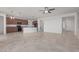 Open concept kitchen with island, dark cabinetry, and tile flooring at 20403 W Calle Encorvada --, Buckeye, AZ 85396