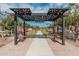 Community park with pergola, benches, and bocce ball court at 20403 W Calle Encorvada --, Buckeye, AZ 85396