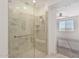 Modern bathroom with a large walk-in shower and glass enclosure at 20403 W Calle Encorvada --, Buckeye, AZ 85396