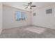 Bright and airy bedroom with plush carpeting and ceiling fan at 20403 W Calle Encorvada --, Buckeye, AZ 85396