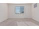 Well-lit bedroom featuring neutral walls and carpet flooring at 20403 W Calle Encorvada --, Buckeye, AZ 85396