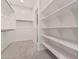 Spacious walk-in closet with built-in shelving and hanging rods at 20403 W Calle Encorvada --, Buckeye, AZ 85396