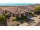 Single story home with tile roof and two-car garage at 20403 W Calle Encorvada --, Buckeye, AZ 85396