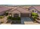 Single-story home with a two-car garage and landscaped front yard at 20403 W Calle Encorvada --, Buckeye, AZ 85396
