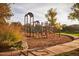 playground with modern equipment and safety surfacing at 21601 W Mariposa St, Buckeye, AZ 85396