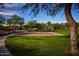 Outdoor basketball court with well-maintained grass surroundings at 21601 W Mariposa St, Buckeye, AZ 85396