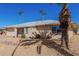 Side view of the house, highlighting its design and landscaping at 18633 N Conquistador Dr, Sun City West, AZ 85375