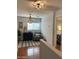 Bright hallway with wood floors, a sitting area and a view into a bedroom at 8953 E Yucca St, Scottsdale, AZ 85260