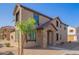 Two-story home with stone accents and a welcoming entrance at 817 E Agua Fria Ln, Avondale, AZ 85323