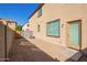 Private backyard with gravel and access to the home at 817 E Agua Fria Ln, Avondale, AZ 85323