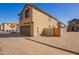 Two-story home with attached garage and desert landscaping at 817 E Agua Fria Ln, Avondale, AZ 85323