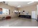 Spacious garage with ample storage and workbenches at 11270 E Quarry Trl, Scottsdale, AZ 85262