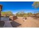 Landscaped backyard with stone pathway and desert landscaping at 11270 E Quarry Trl, Scottsdale, AZ 85262