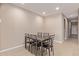 Dining area with a dark table and six chairs at 12121 W Wier Ave, Avondale, AZ 85323