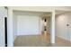 Open living room with tile flooring and access to backyard at 18195 N San Juan St, Maricopa, AZ 85138