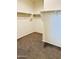 Large walk-in closet with shelving and hanging rod at 18195 N San Juan St, Maricopa, AZ 85138