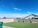 Artificial turf backyard with a privacy wall and ample space at 18195 N San Juan St, Maricopa, AZ 85138