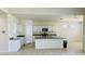 Bright kitchen featuring an island and white cabinetry at 18195 N San Juan St, Maricopa, AZ 85138
