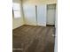 Spacious bedroom with plush carpeting and a sizable closet at 18195 N San Juan St, Maricopa, AZ 85138