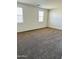 Spacious bedroom with neutral carpeting and ample natural light at 18195 N San Juan St, Maricopa, AZ 85138