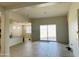 Bright and airy living room with sliding glass door to patio at 18195 N San Juan St, Maricopa, AZ 85138