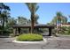 Gated community entrance with covered security booth at 7740 E Gainey Ranch Rd # 24, Scottsdale, AZ 85258