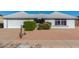 House exterior with a two-car garage and landscaping at 11451 S Pawnee Cir, Phoenix, AZ 85044