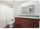 Bathroom boasts granite countertop and wood cabinets at 11451 S Pawnee Cir, Phoenix, AZ 85044