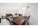 Bright dining room features a wood table with six chairs and a chandelier at 11451 S Pawnee Cir, Phoenix, AZ 85044