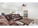 Living room with sectional sofa and open view to the kitchen at 11451 S Pawnee Cir, Phoenix, AZ 85044