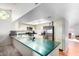 Kitchen with stainless steel appliances and a large green countertop at 11451 S Pawnee Cir, Phoenix, AZ 85044