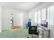 Home office with desk, water cooler, and window at 11451 S Pawnee Cir, Phoenix, AZ 85044