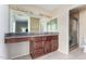 Bathroom features a vanity with granite countertop and a shower at 11451 S Pawnee Cir, Phoenix, AZ 85044
