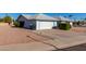 House exterior features a carport and well-manicured landscaping at 11451 S Pawnee Cir, Phoenix, AZ 85044