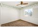 Charming bedroom with ceiling fan and window at 11451 S Pawnee Cir, Phoenix, AZ 85044