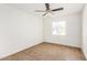 Bright bedroom with ceiling fan and window shutters at 11451 S Pawnee Cir, Phoenix, AZ 85044