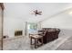 Living room with fireplace, recessed lighting, and access to a patio at 11451 S Pawnee Cir, Phoenix, AZ 85044