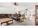 Open living room with a view of the kitchen and a large sectional sofa at 11451 S Pawnee Cir, Phoenix, AZ 85044